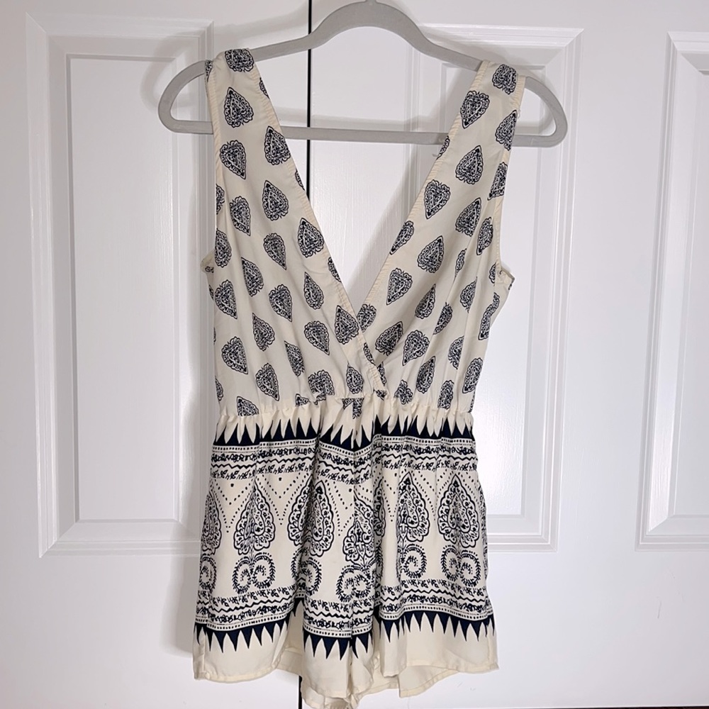 Adorable open back romper
